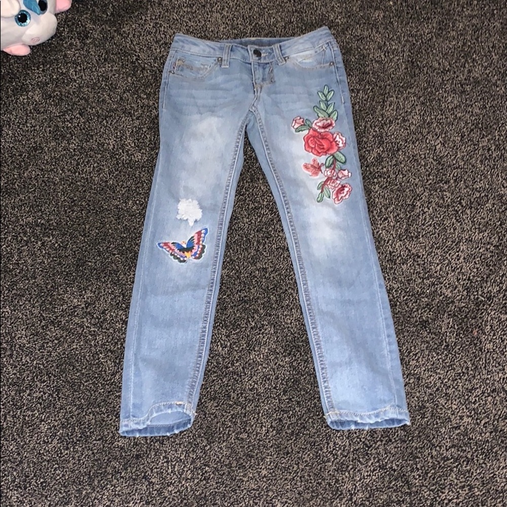 Jeans with a butterfly and flowers